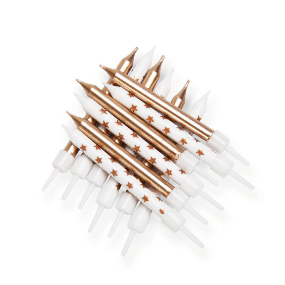 Velas douradas e estrelas douradas