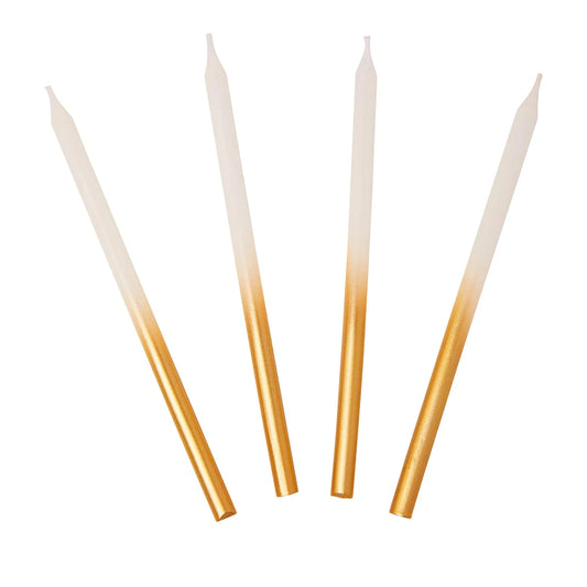 Velas compridas brancas e douradas